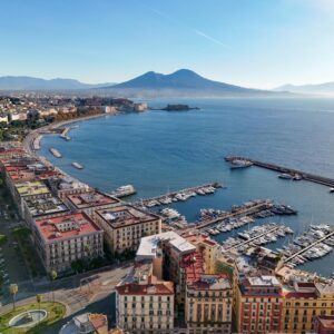 Stunning aerial view of Naples, Italy with Mount Vesuvius and marina.
