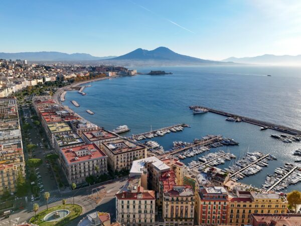 Stunning aerial view of Naples, Italy with Mount Vesuvius and marina.